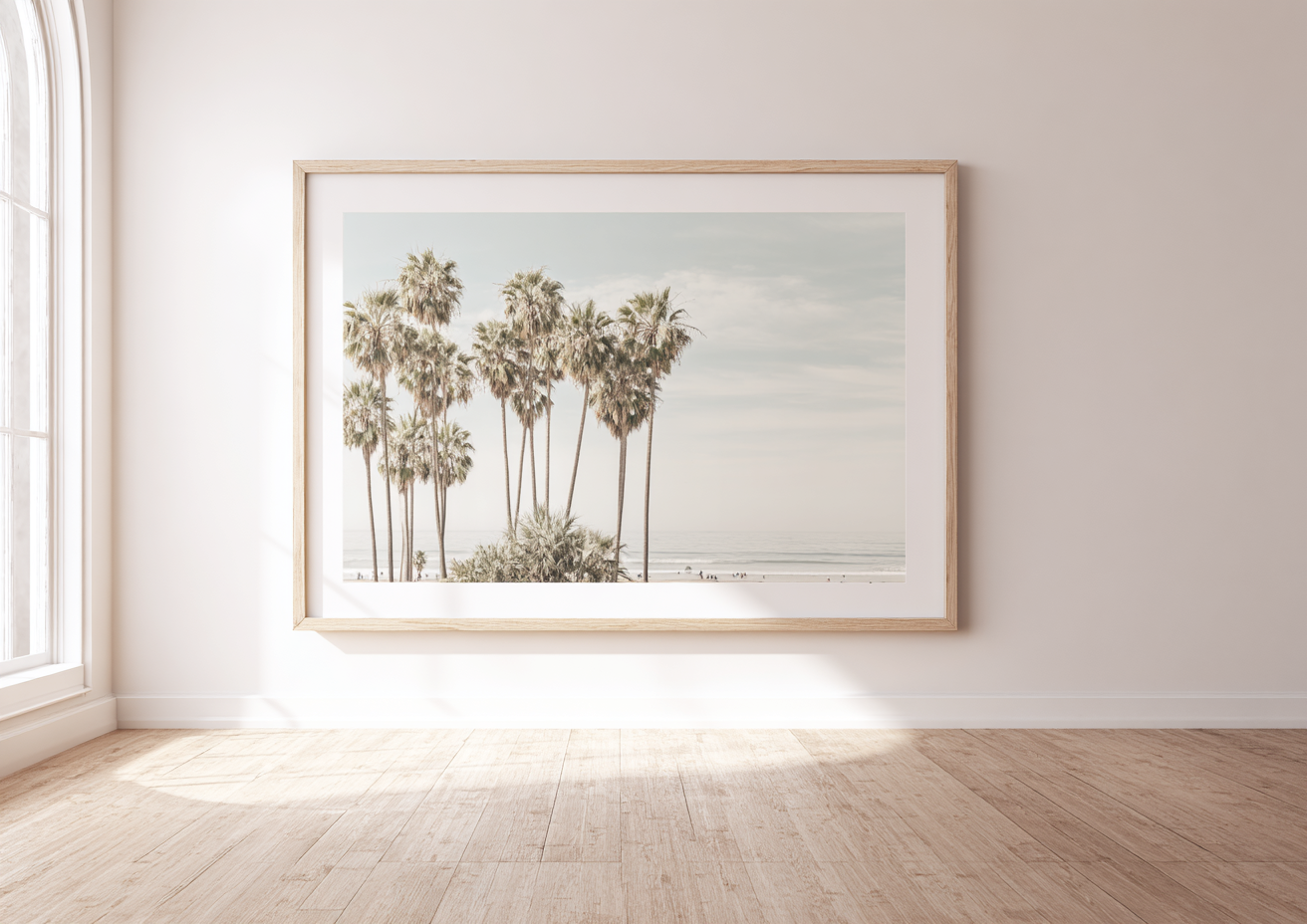 Pacific Palms - Tall California palm trees against hazy sky with beach below
