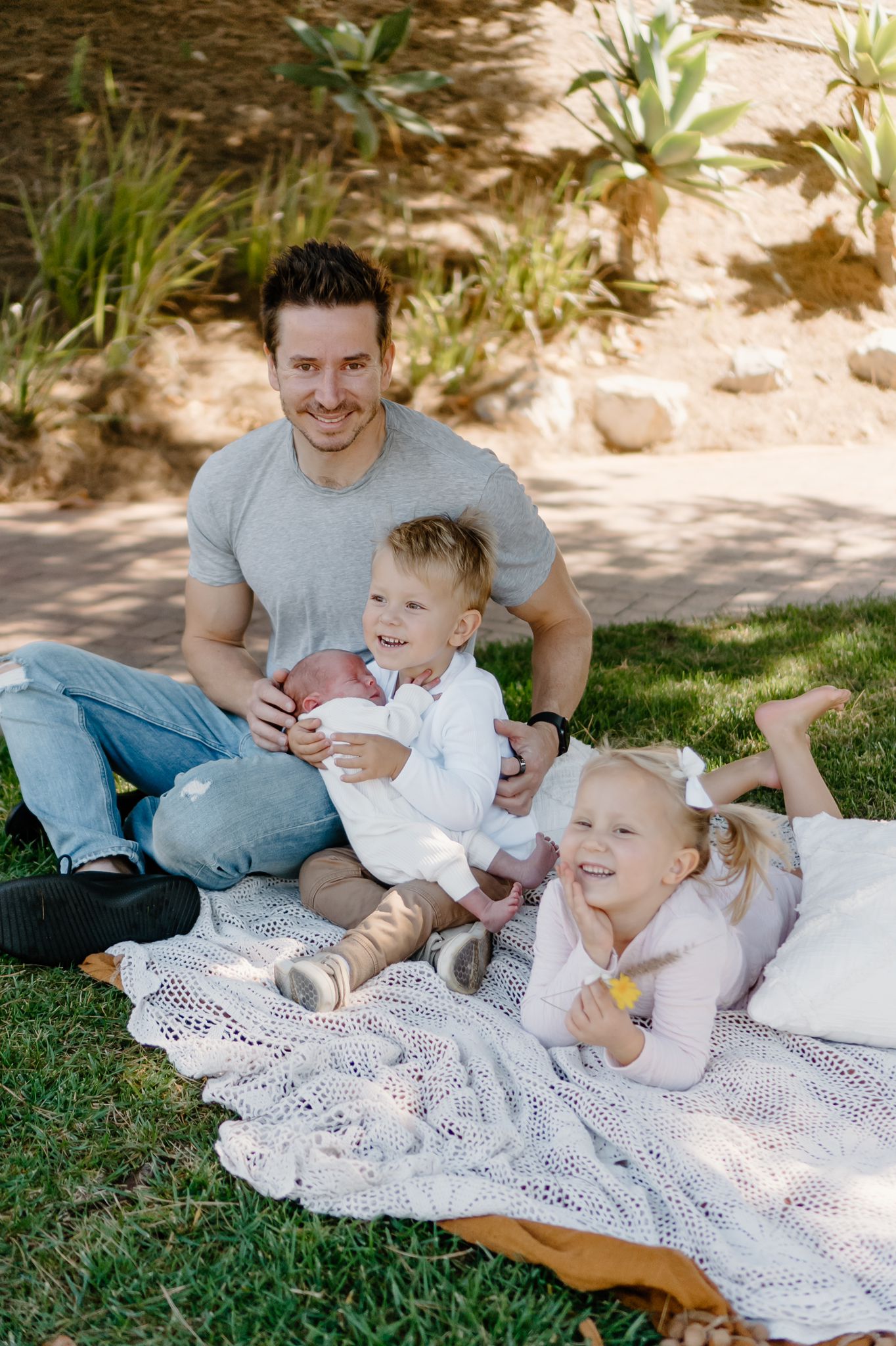 David with kids on a picnic blanket