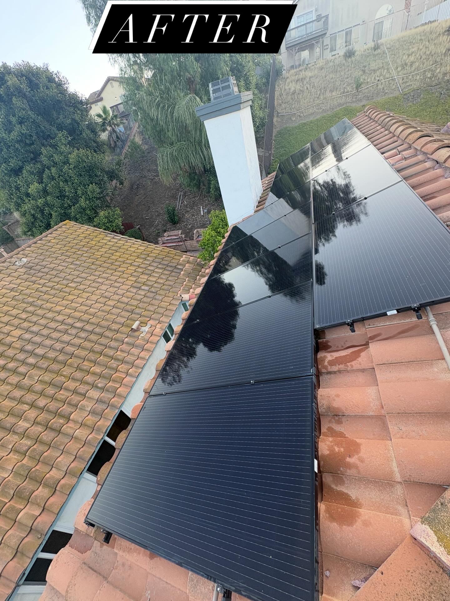 Clean solar panels on terracotta tile roof