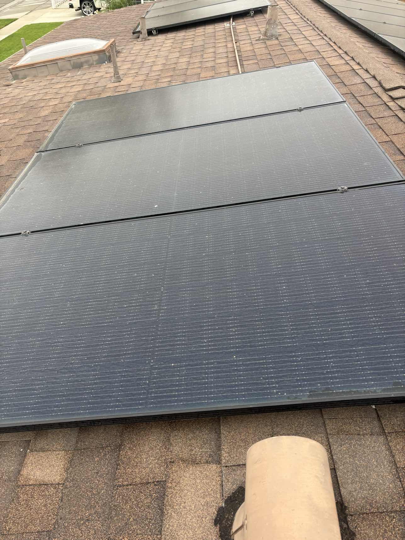 Solar panels mid-cleaning process