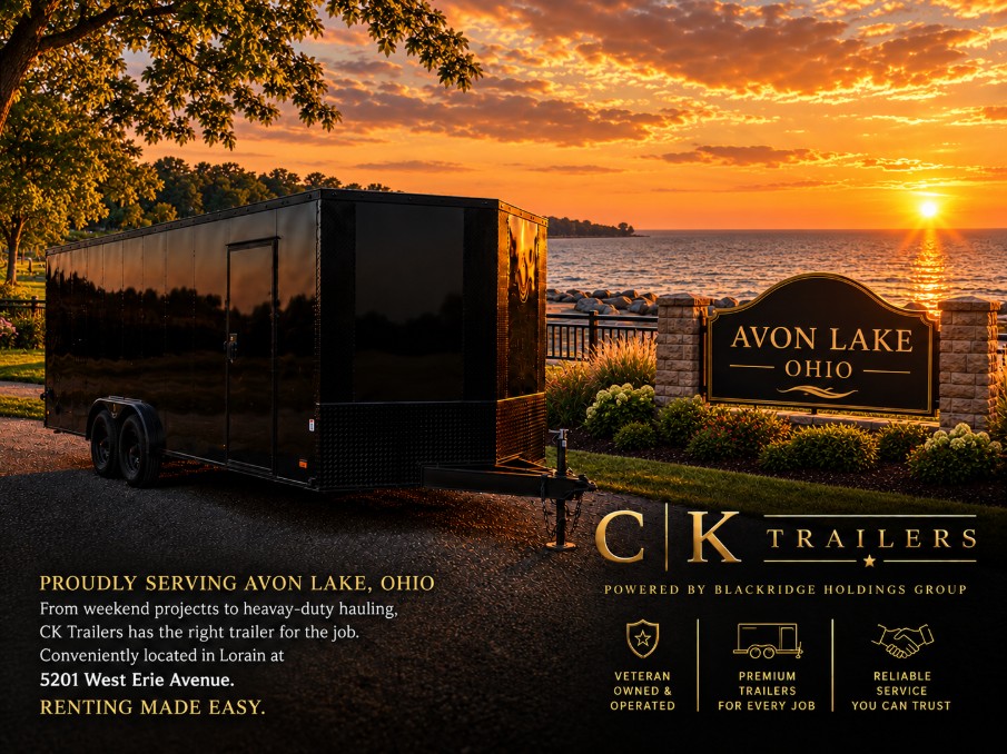 Black CK Trailers enclosed trailer parked near the Avon Lake Ohio sign on the Lake Erie shoreline at sunset