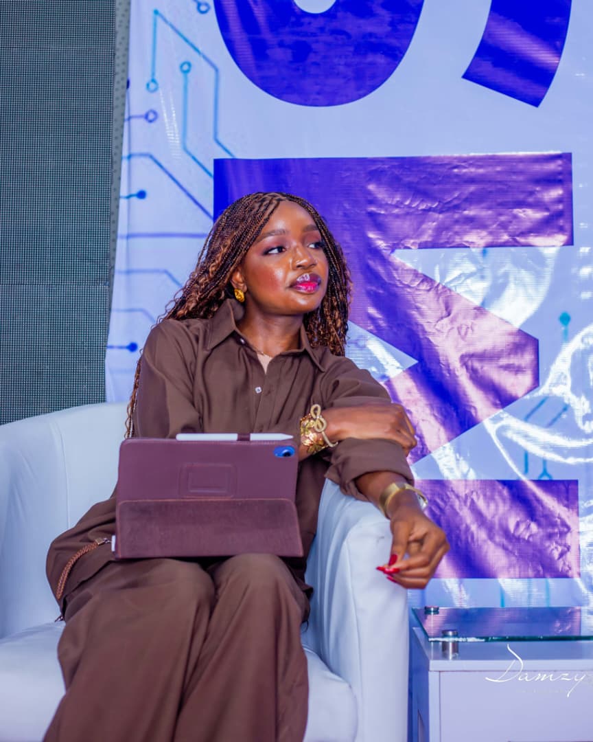 Suliat in a brown outfit at an event