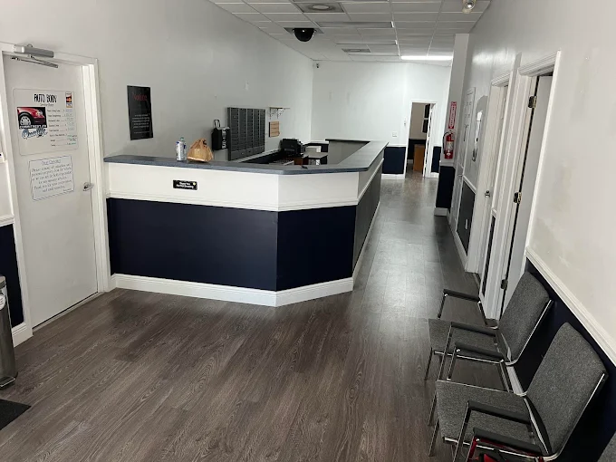 Clean, modern reception and customer waiting area at Factory Finish Paint and Body in Lake Worth Beach