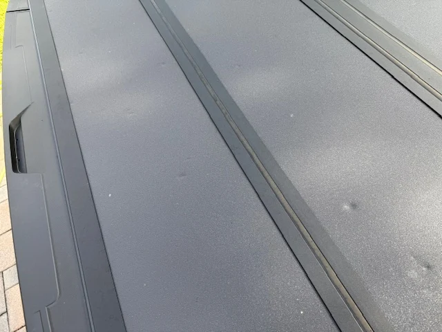 Close-up macro of a fresh painted body panel finished at Factory Finish
