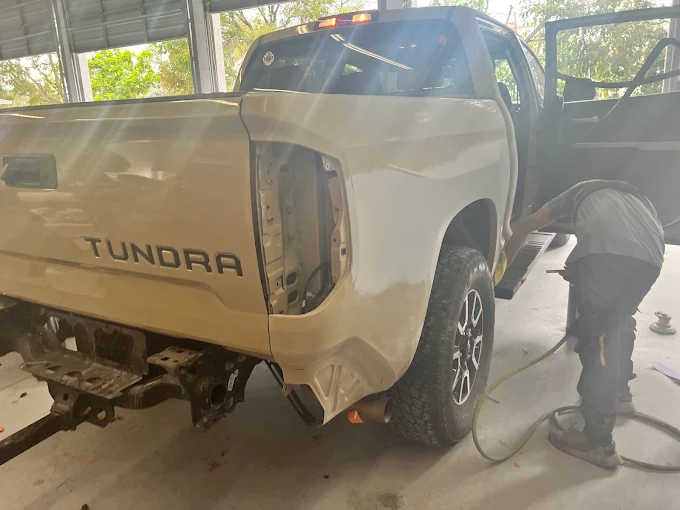 Toyota Tundra rear bedside disassembled by a technician for body repair at Factory Finish
