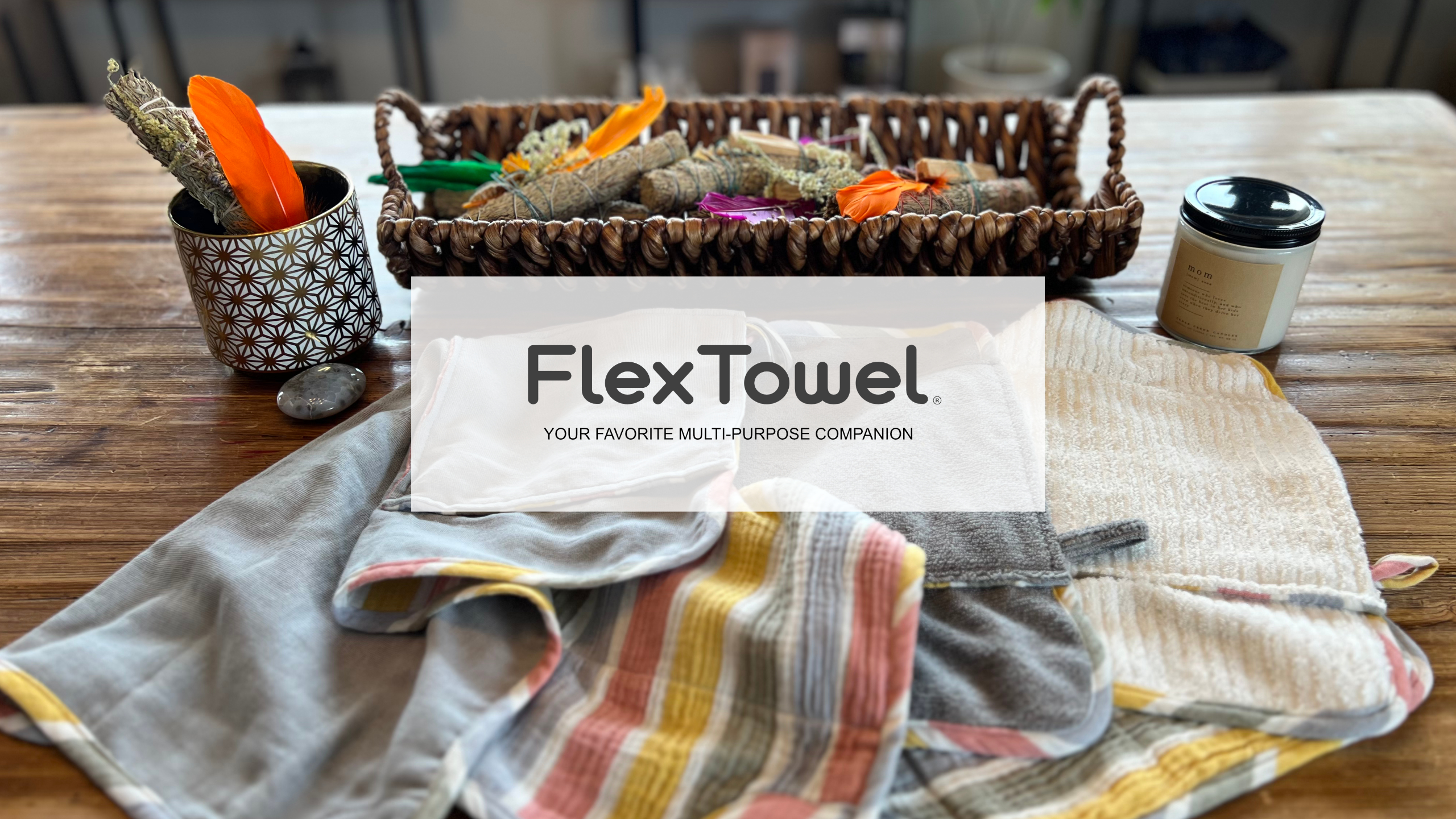 FlexTowel multi-purpose household towels displayed on a wooden kitchen counter with kitchen utensils and accessories