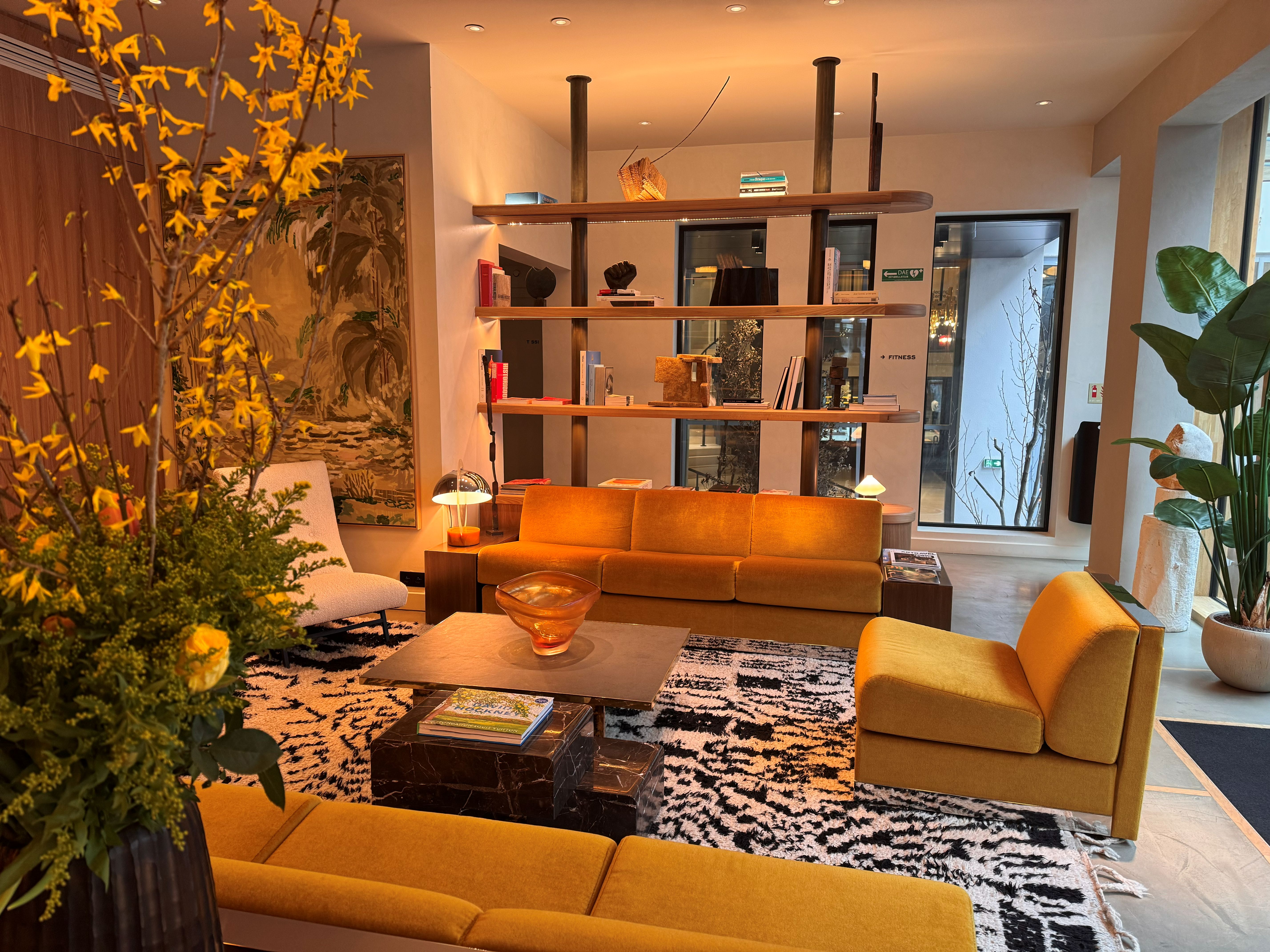 Stylish boutique hotel lobby with velvet sofas