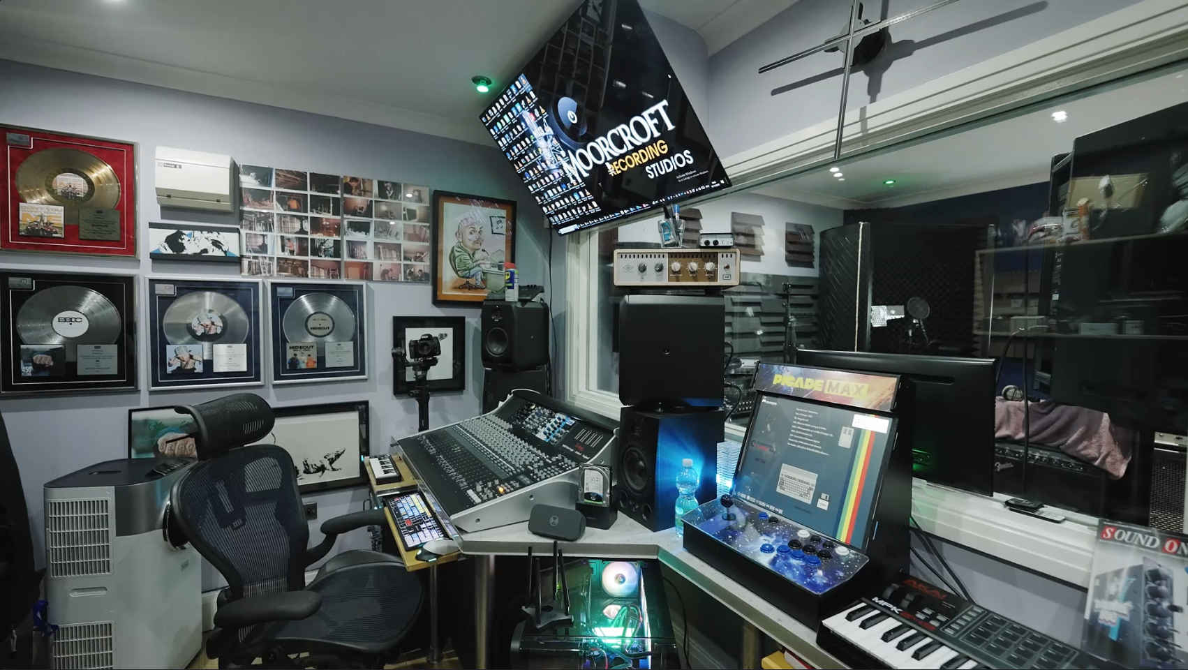 Moorcroft Recording Studios control room with mixing console, gold and platinum records, and studio equipment