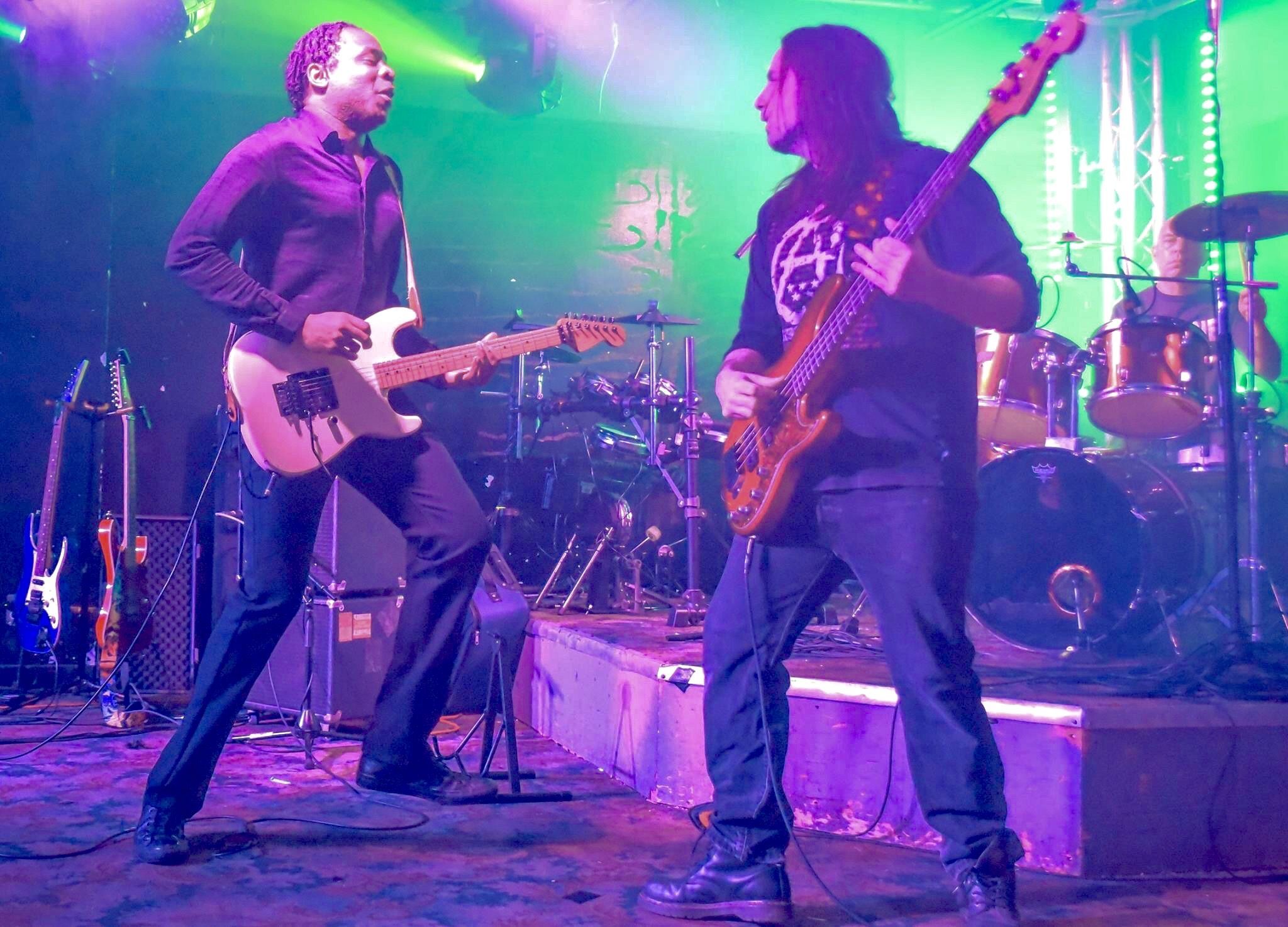 fyoosha guitarist and bassist performing together on stage