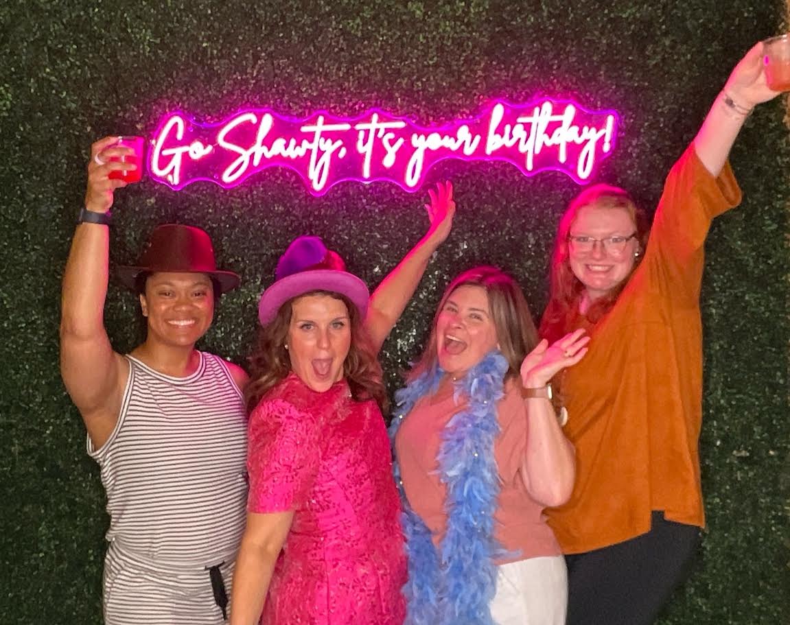 Birthday party photobooth rental Nashville with neon sign and greenery backdrop