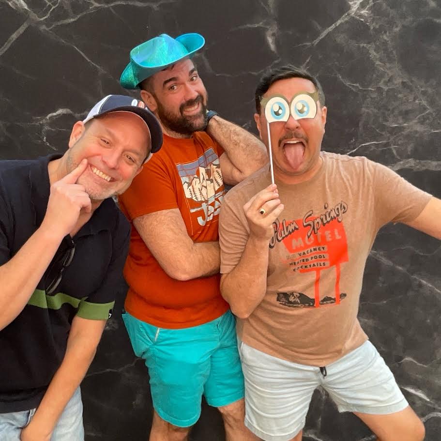 Friends enjoying Nashville photobooth rental with props marble backdrop
