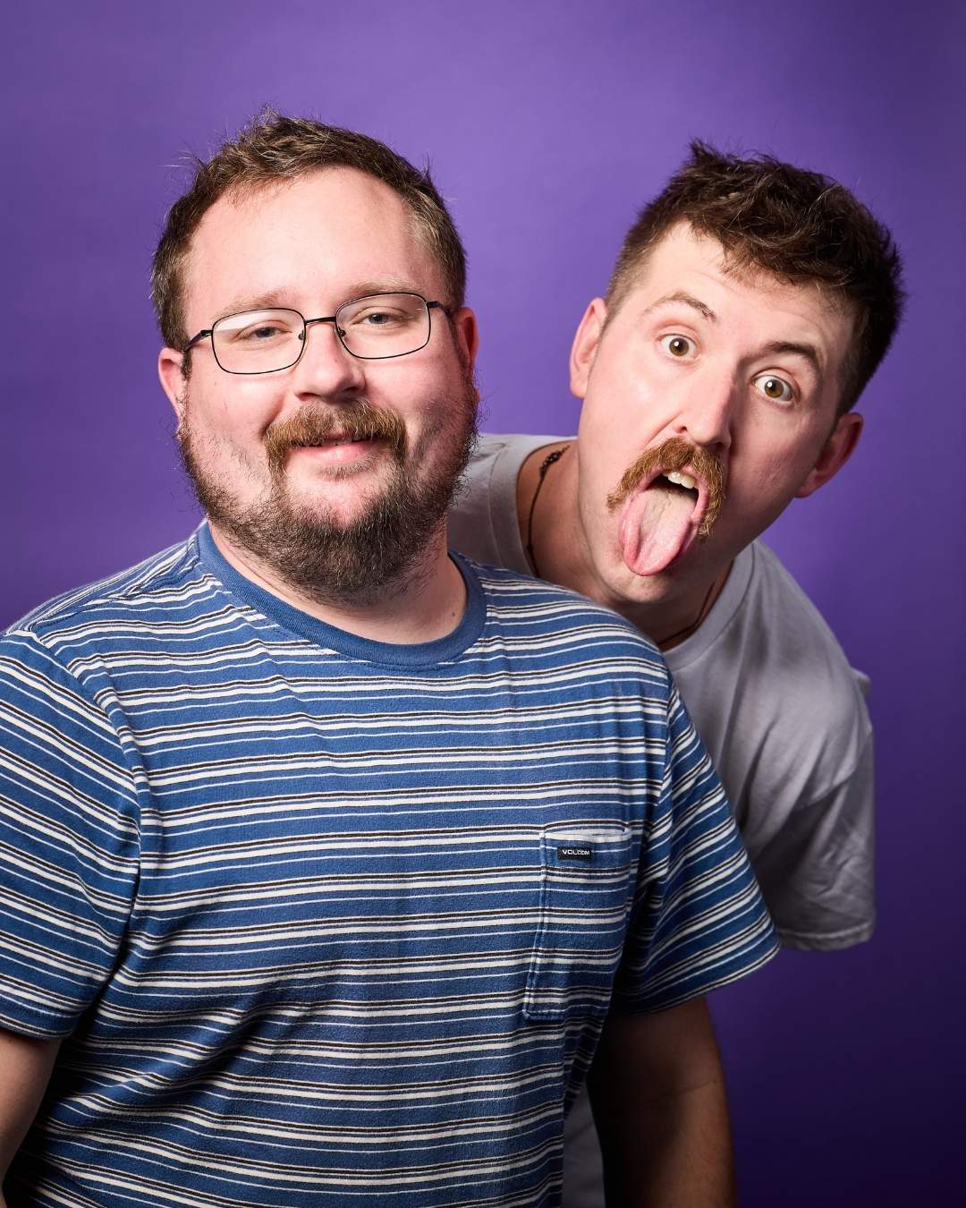 Good Cop / Rad Cop headshot with Dave Hannah and Ryan Darling against purple background