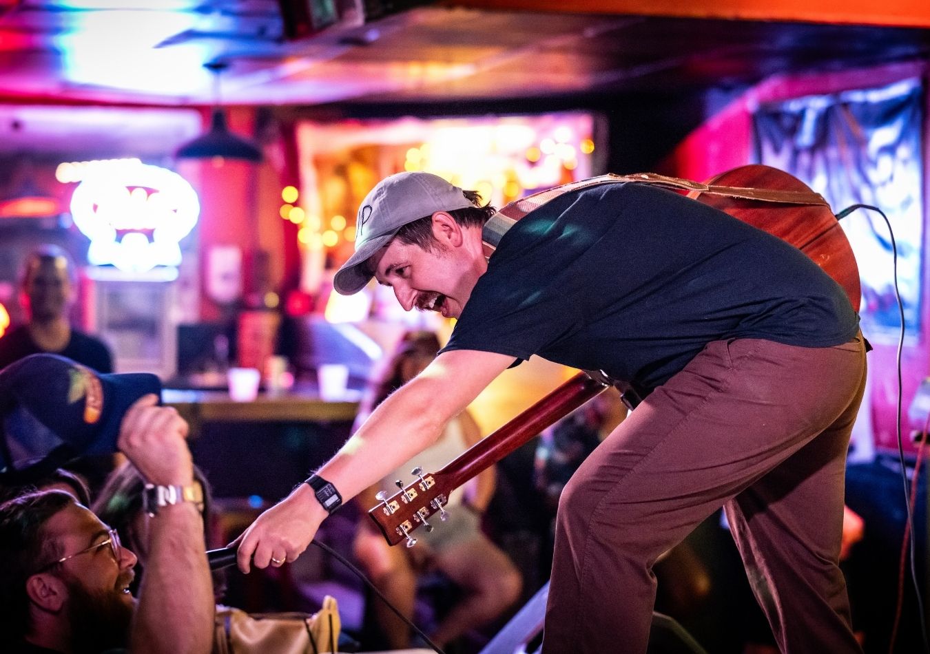 Good Cop / Rad Cop performing live on stage with guitar engaging the crowd