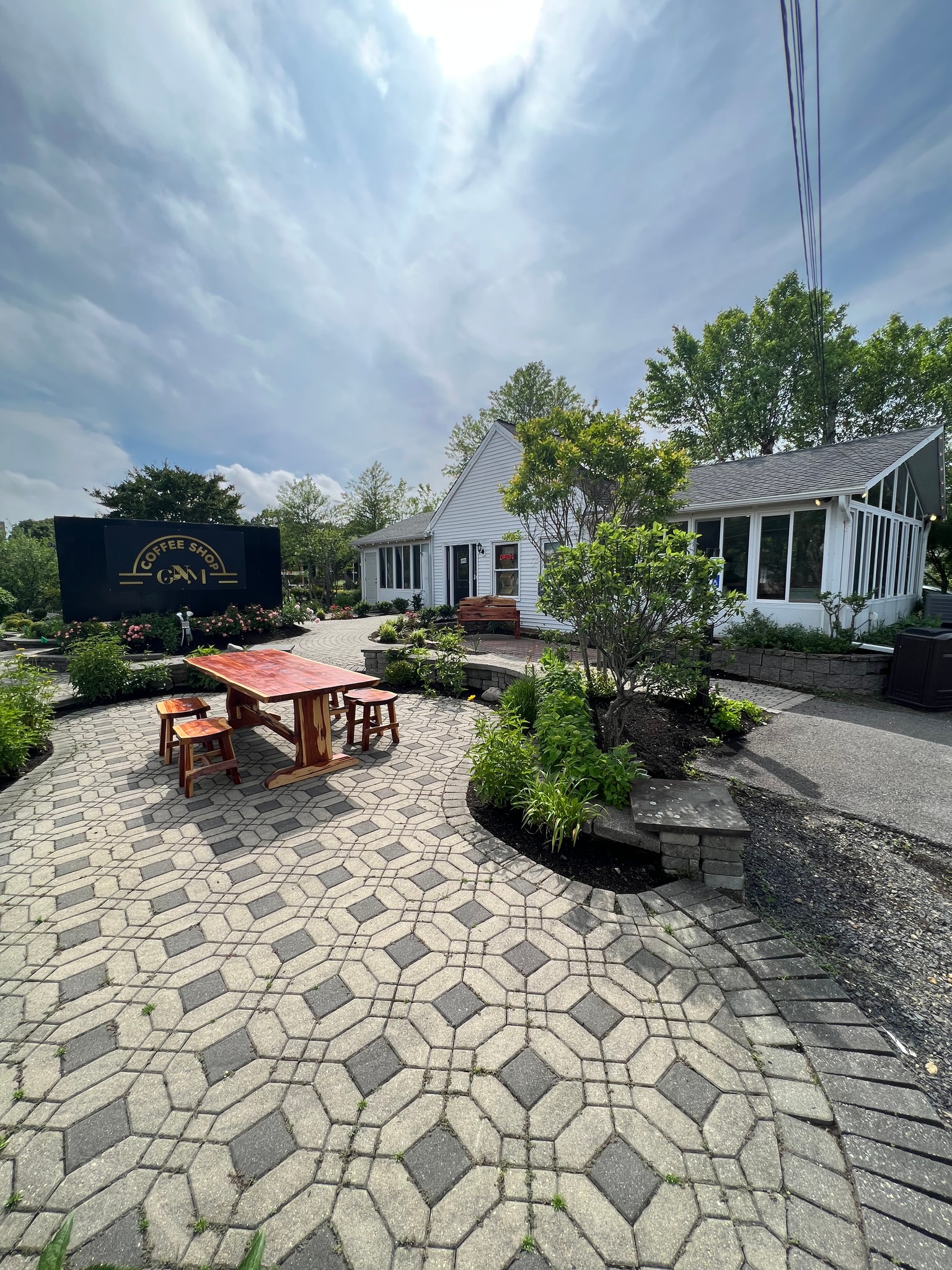 GNM Coffee Shop exterior with patio seating and landscaping in Barnegat NJ