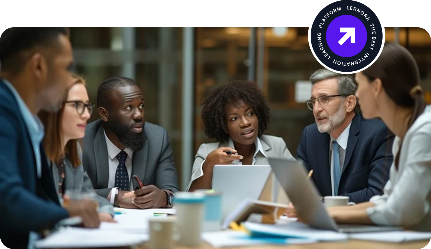 Diverse team of professionals collaborating in a modern meeting room with Lernora badge