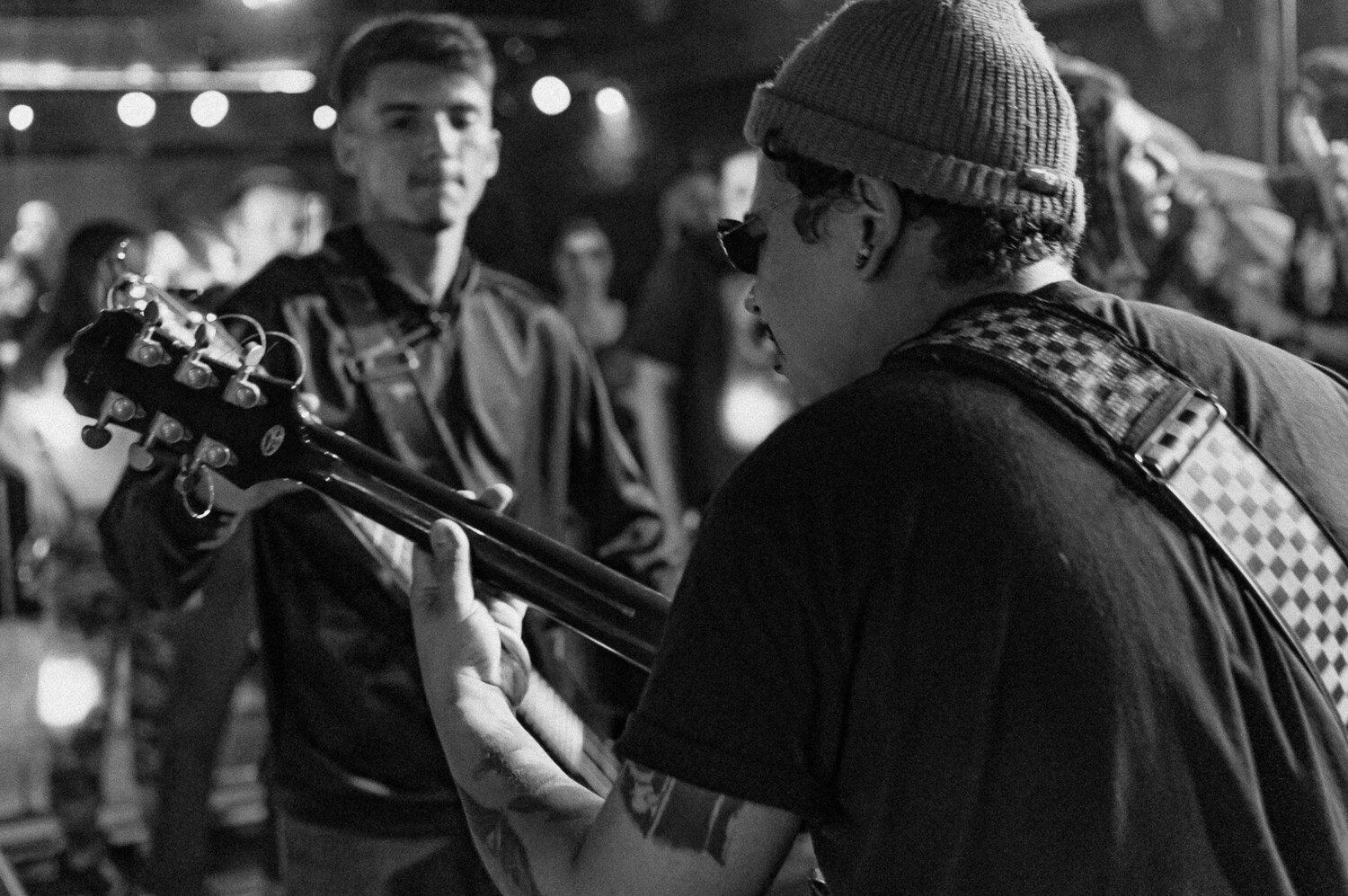 Guitarist performing at a gig in black and white