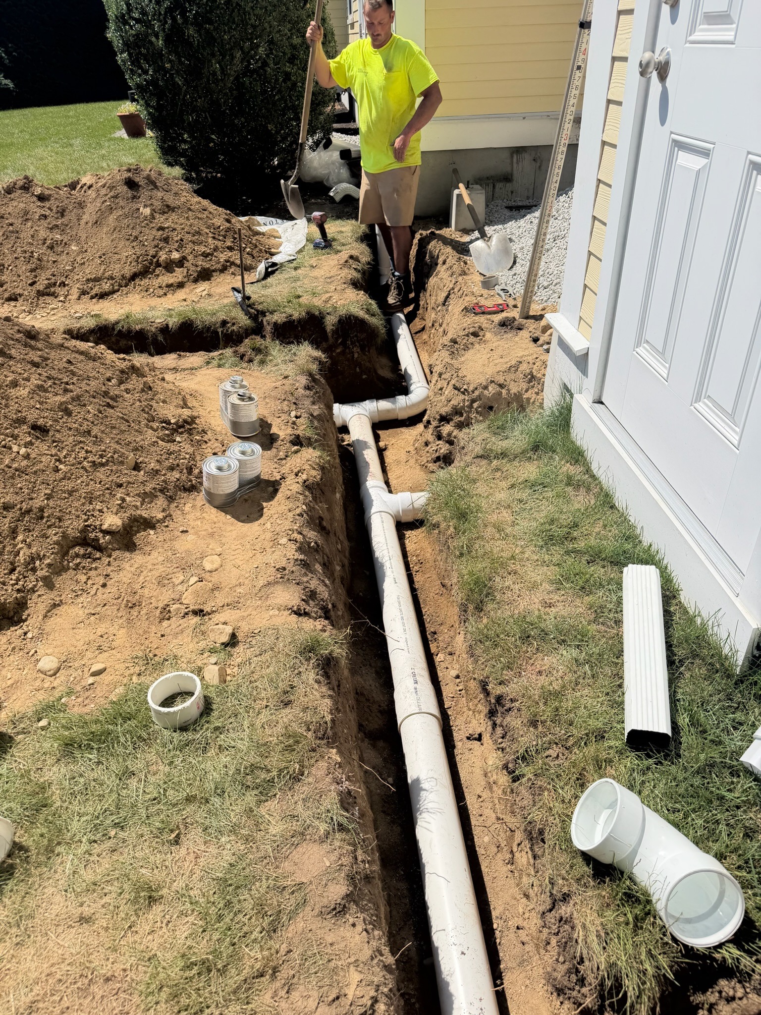 DS Benoit worker installing residential gutter drainage piping