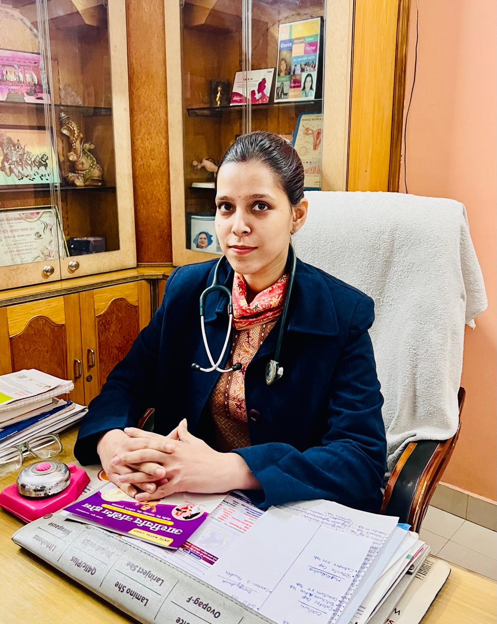 Dr. Aishwina Anand seated in her consultation room