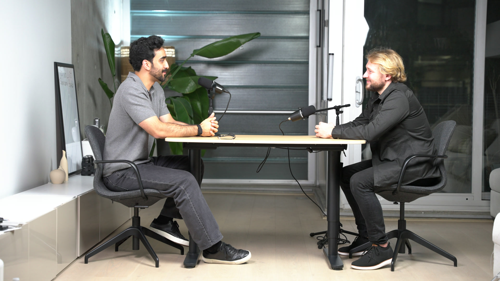 Haris Malik and host Francisk Hanchar seated together during a studio conversation