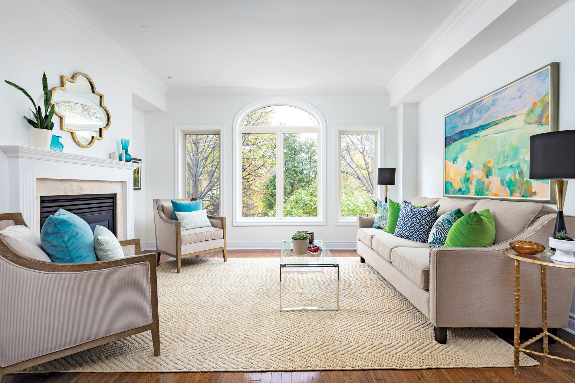 Bright traditional living room with arched windows and colorful accents