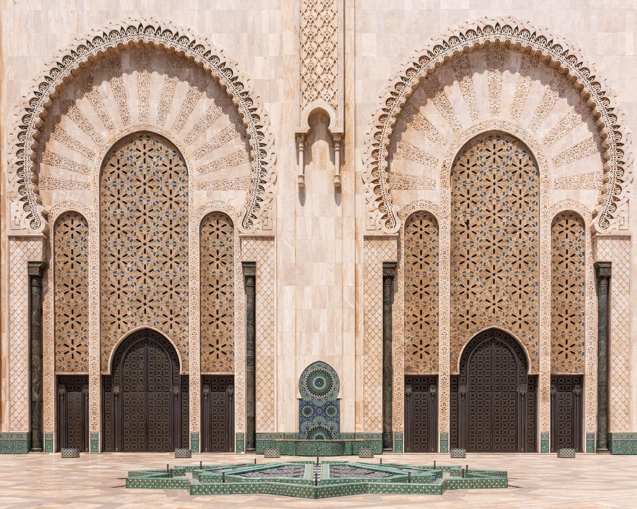 Hassan II Mosque architectural exterior detail with intricate arches and tile work