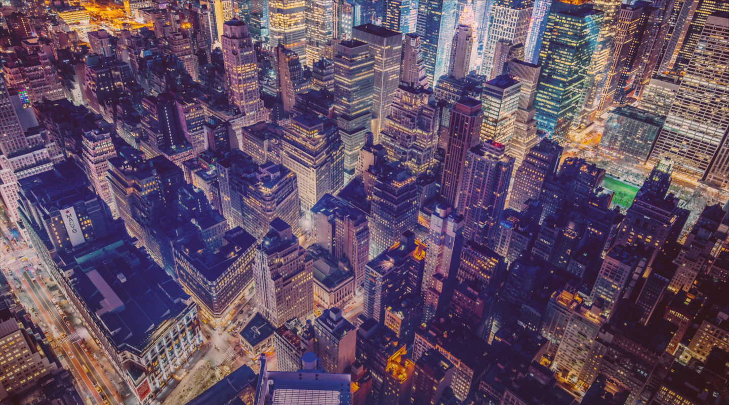 City skyline at night showing modern buildings