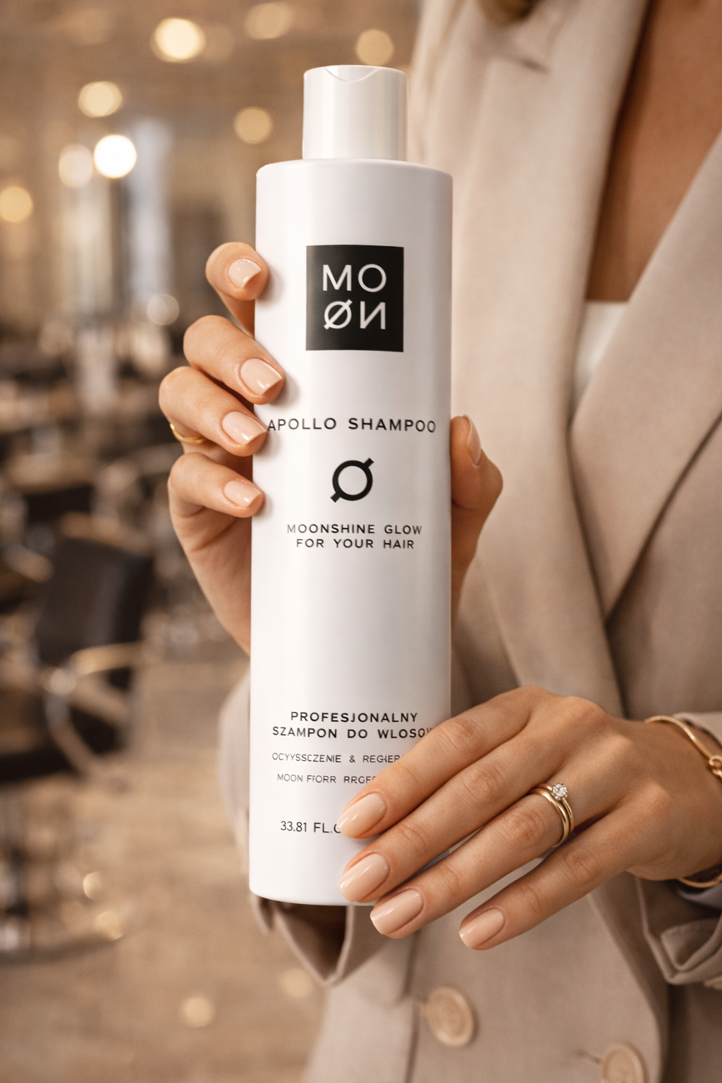 MOØN shampoo bottle held in hands