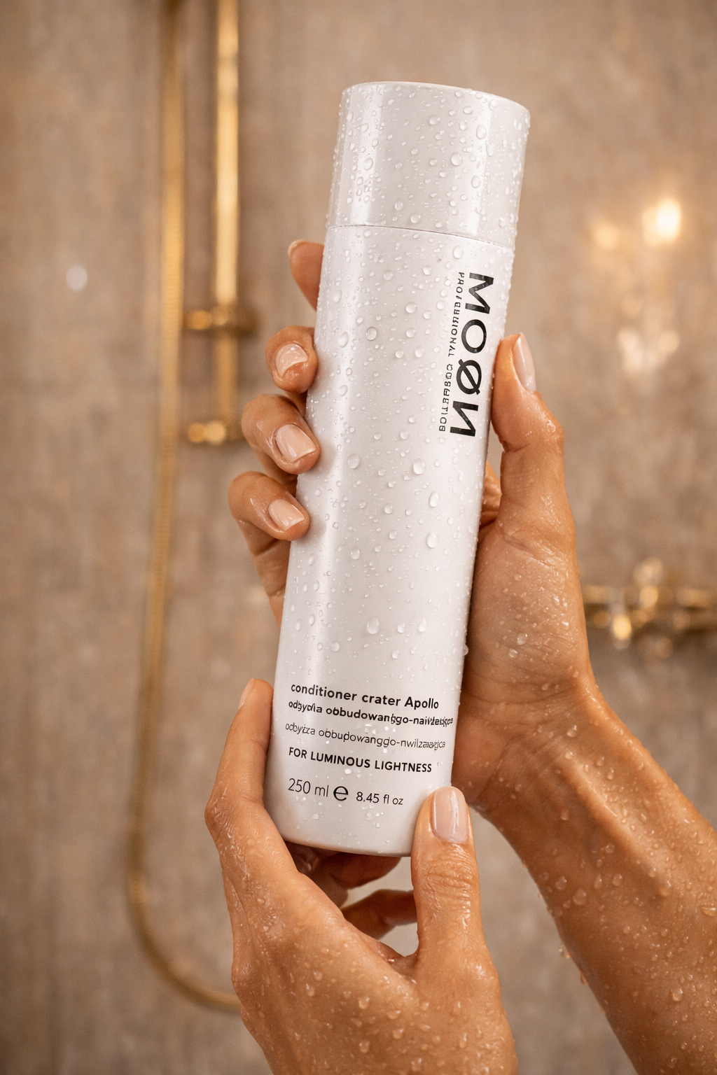 MOØN conditioner crater Apollo held in wet hands in shower
