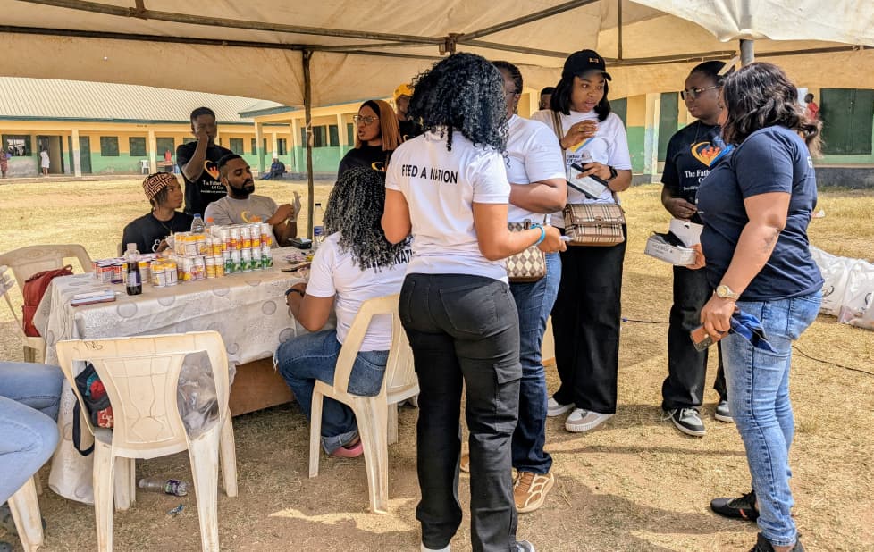 Team members at table during community outreach event