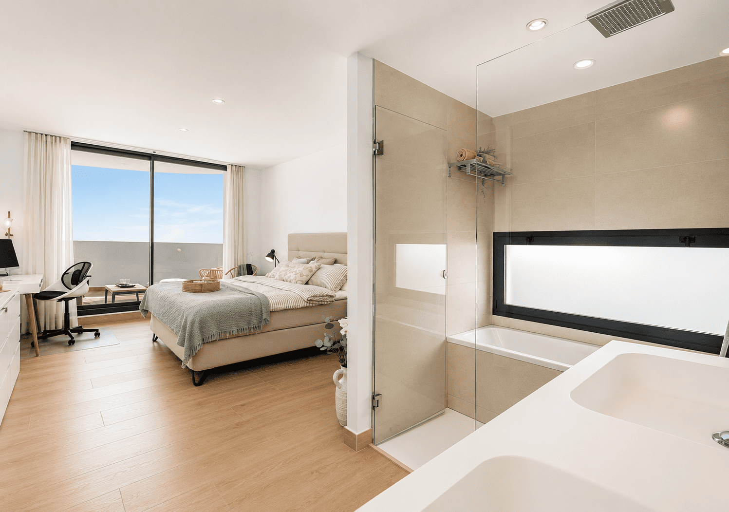 En-suite master bedroom with desk and open bathroom