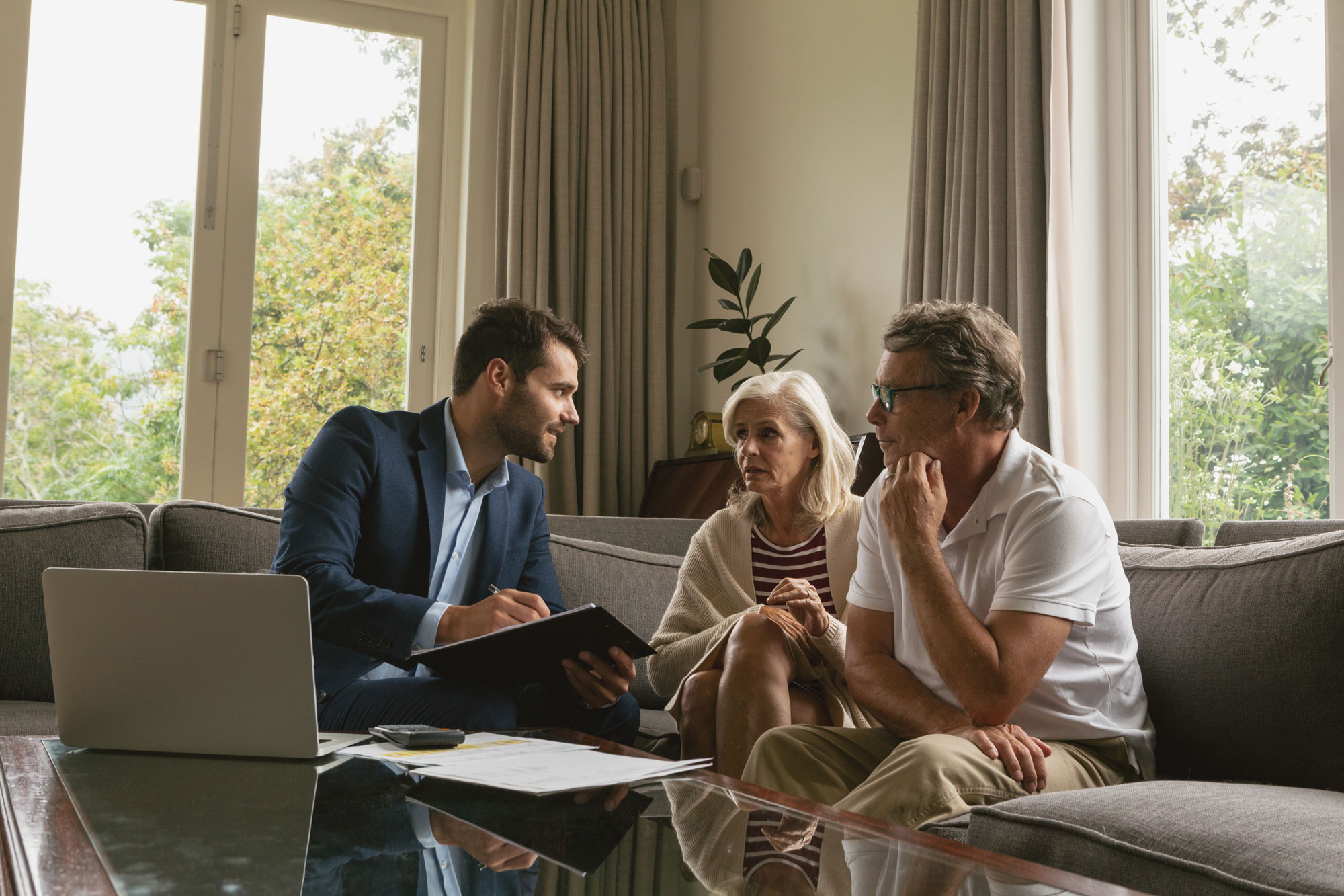 Financial consultant discussing planning options with senior couple