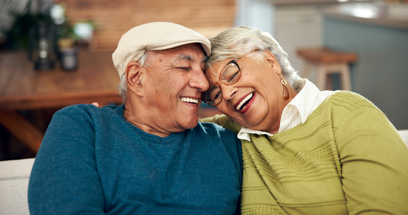 Senior couple sharing a joyful moment together, representing the positive impact of our healthcare platforms