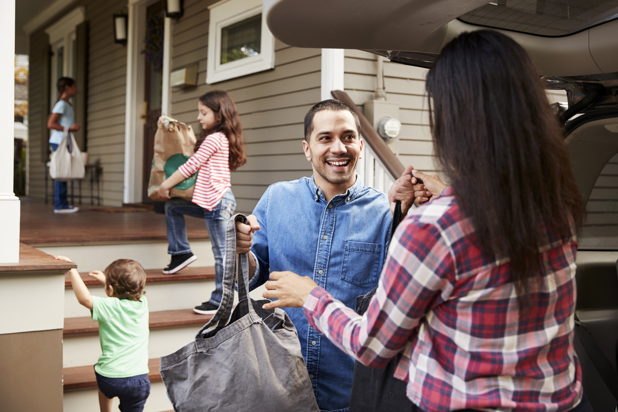 Community members exchanging groceries, showing the impact of food assistance programs