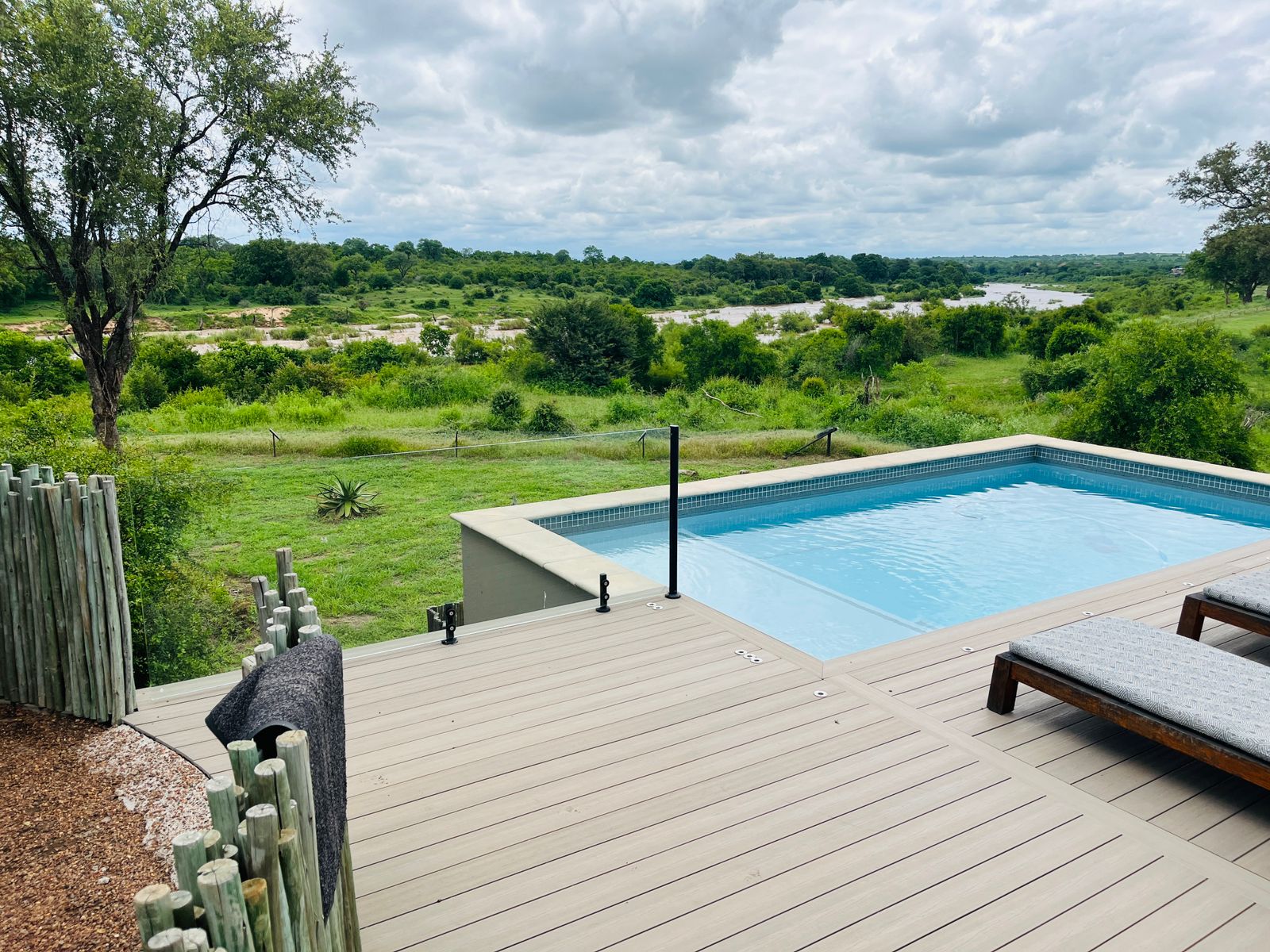 Safari lodge pool overlooking bush
