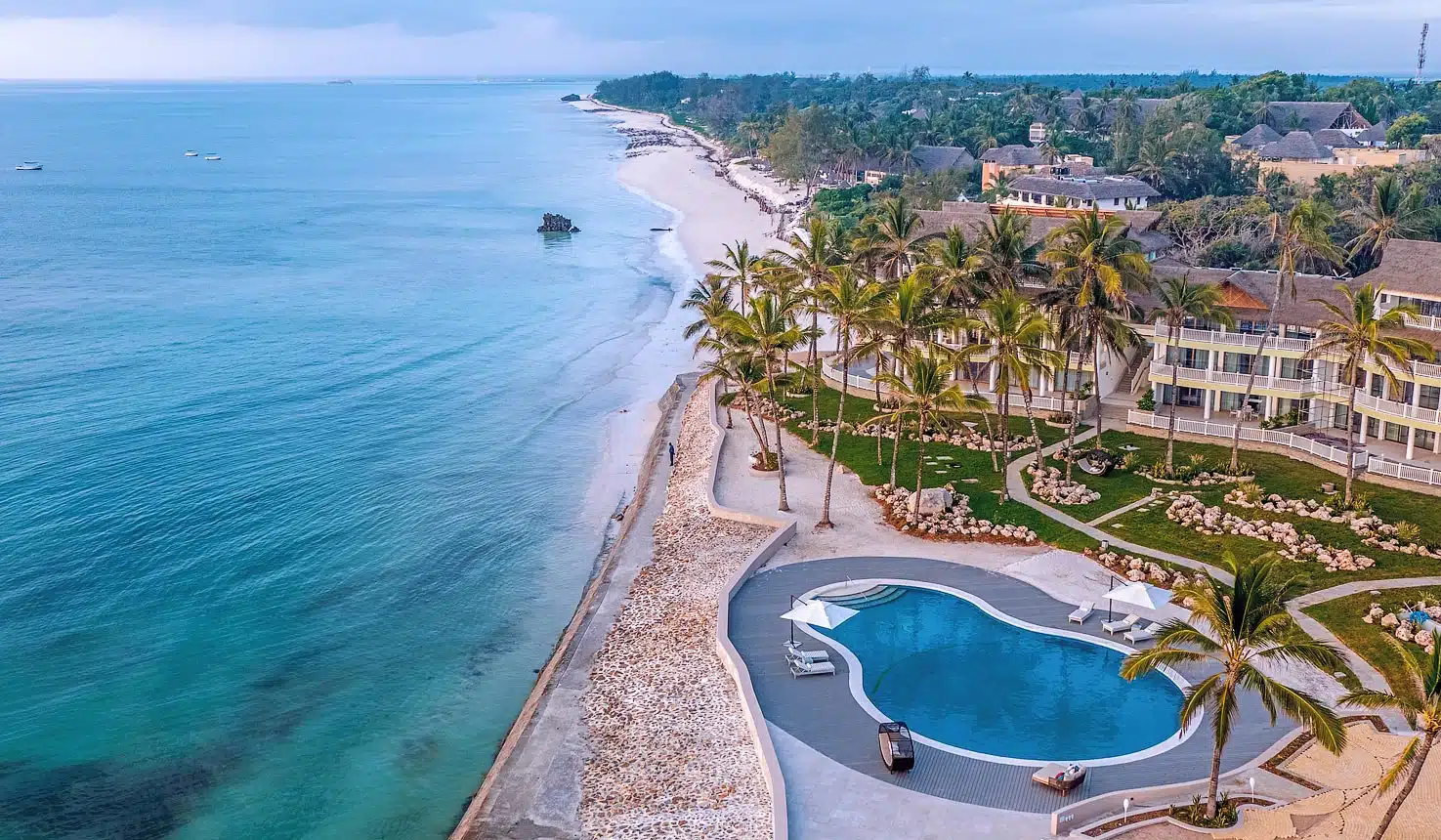 Aerial view of a palm-lined beach resort on the East African coast