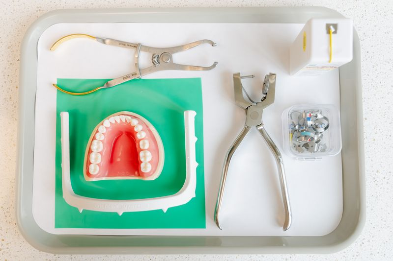 Rubber dam setup with clamps and forceps