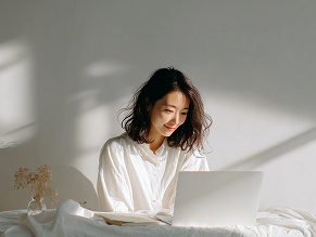 Woman at desk with laptop