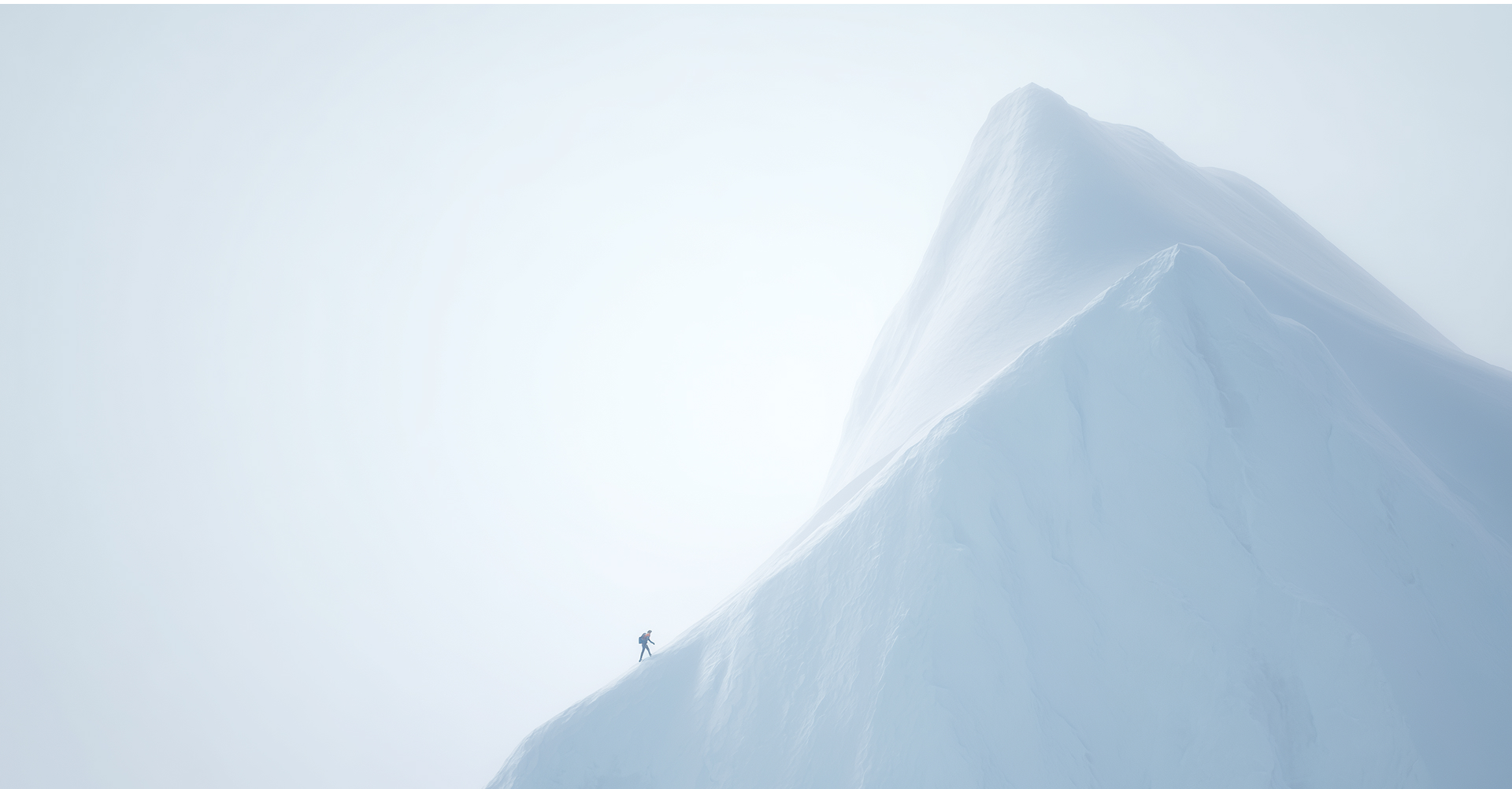 Lone climber on snow peak