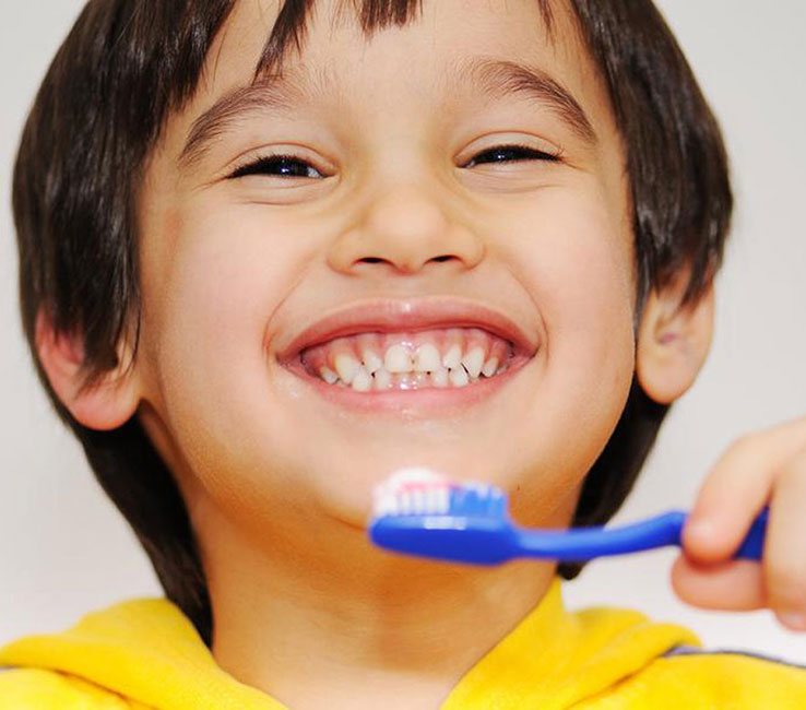 Child brushing teeth