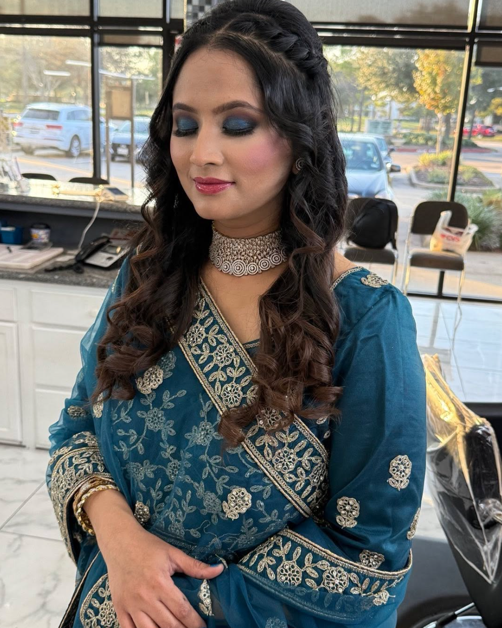 Beautiful bridal makeup with elegant blue traditional dress