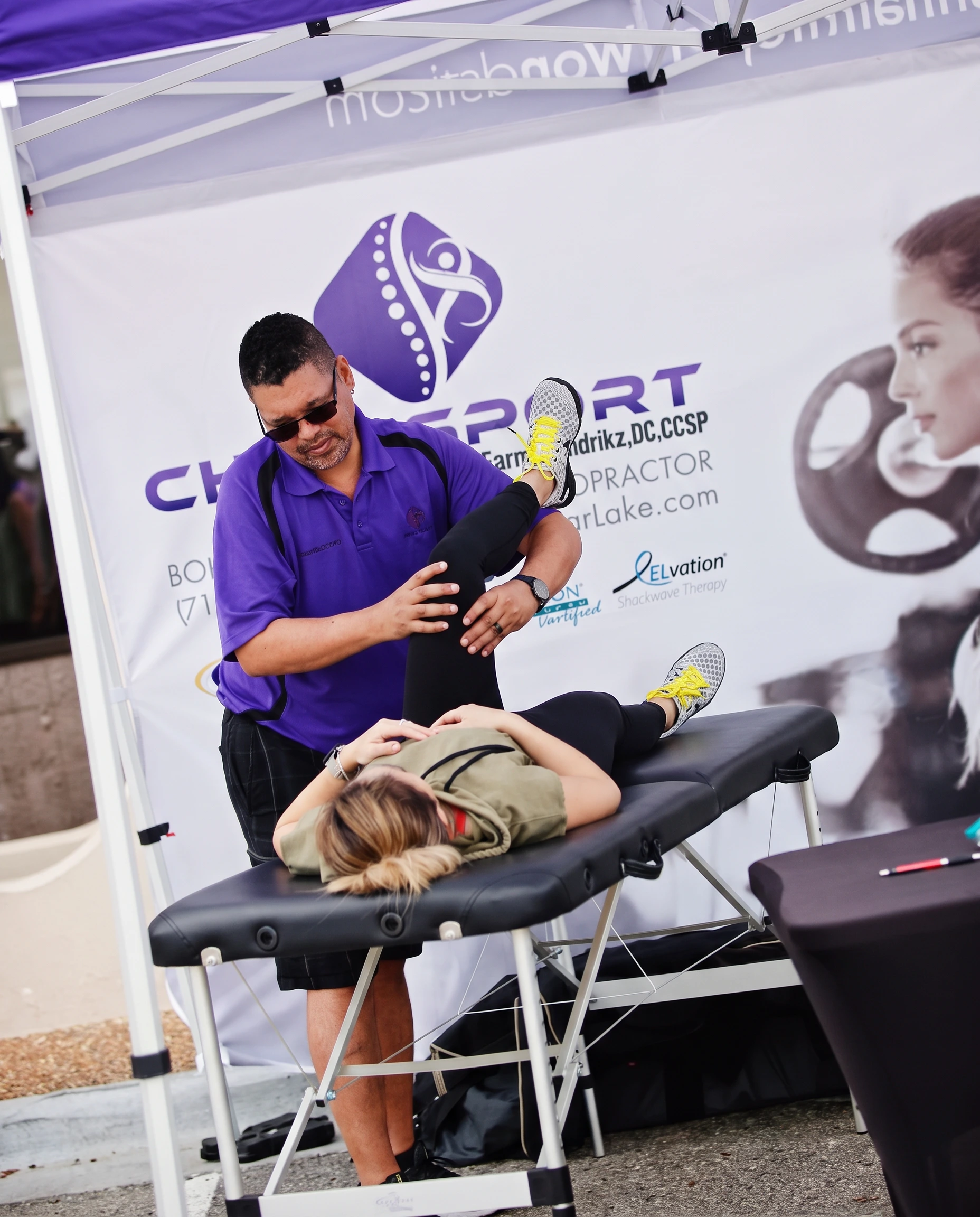 Dr. Hendrikz performing a hamstring and hip assessment on a patient's raised leg
