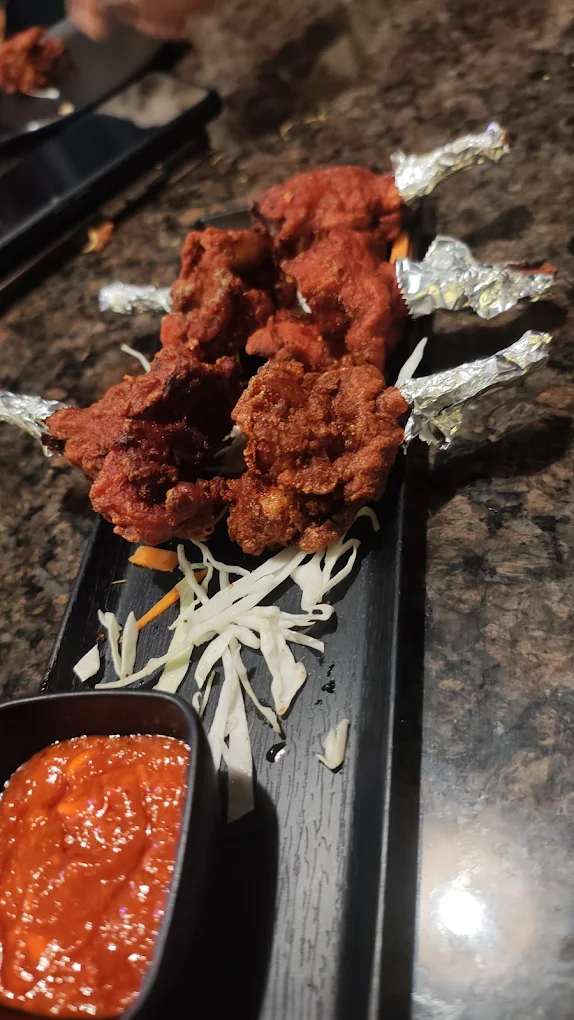 Crispy chicken lollipop with dipping sauce