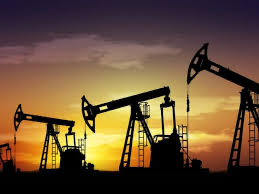 Oil pumpjacks silhouette at sunset