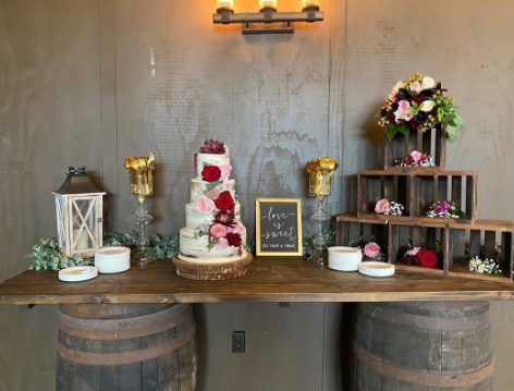Rustic dessert display with wedding cake