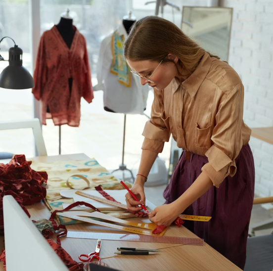 Fashion designer working at studio table