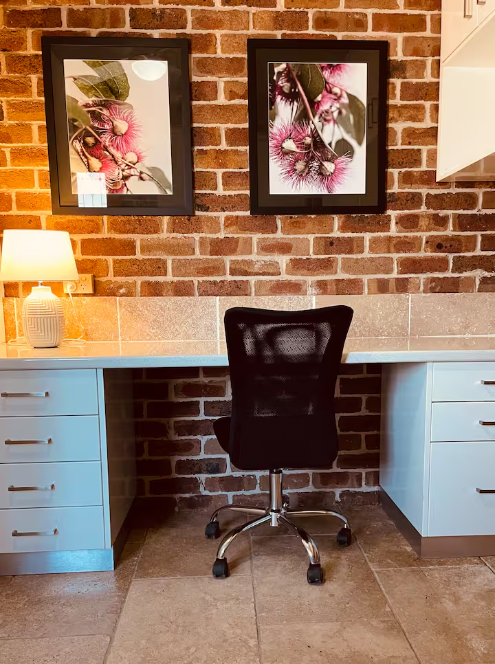 Dedicated workspace with desk and native art