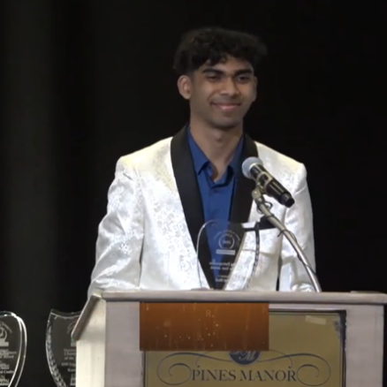 Rishi Shah speaking at a podium