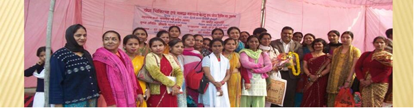 Group of women in traditional attire with certificates