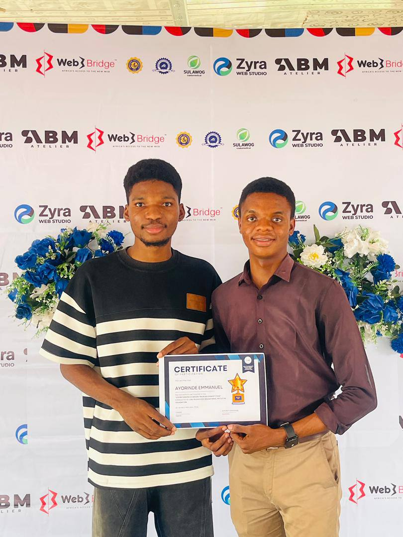 Ayorinde Emmanuel receiving certificate