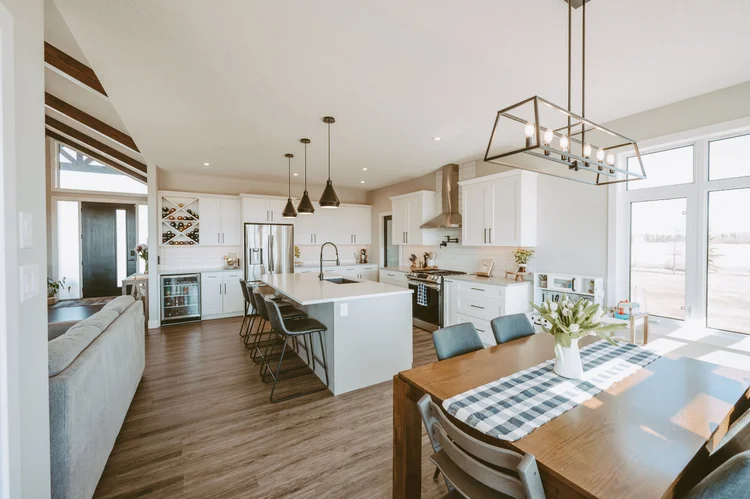 Open concept kitchen dining with wine storage